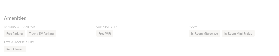 Amenity tags grouped by category on a motel listing