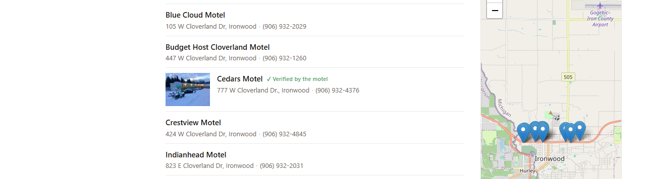 A city listing page where one motel has a photo thumbnail, making it stand out from the other listings around it
